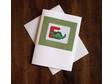 This cross stitch card features a cute little green dinosaur
